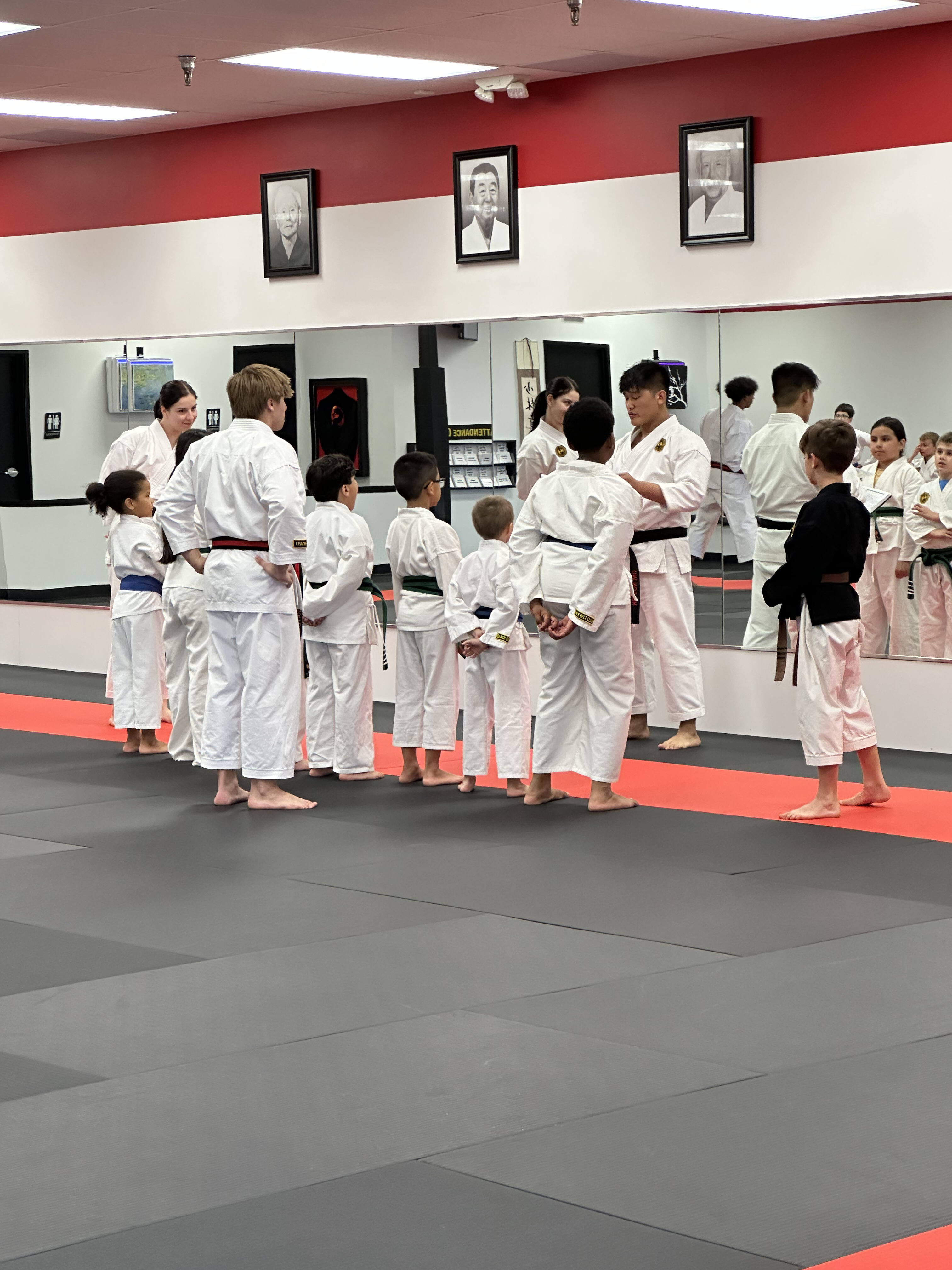 Liam and classmates listening to instructors